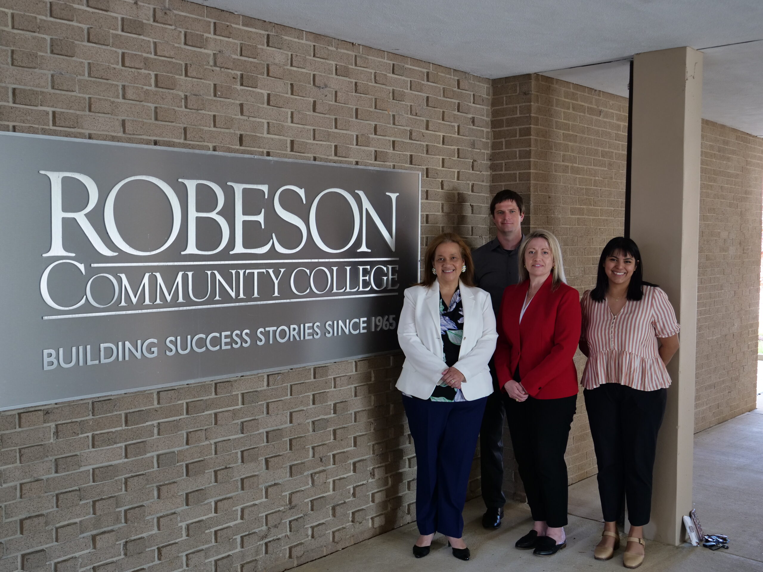 Melissa Singler, president of Robeson Community College, Daniel West, Belk Center Research Associate, Dr. Audrey “AJ” Jaeger, Belk Center Executive Director and W. Dallas Herring Professor, and Nohemi Ramirez, Belk Center Research Associate